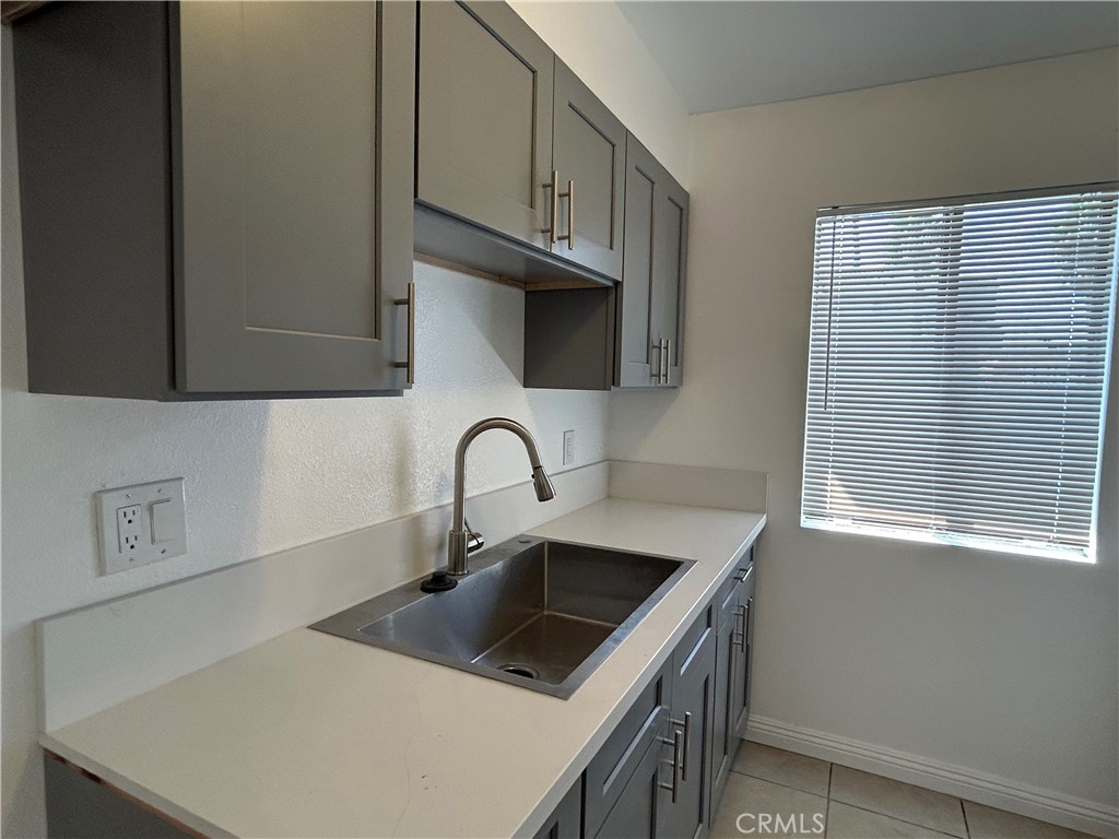 9079 Colony Place Riverside, CA 92503 - Photo 8 of 21 a kitchen with stainless steel appliances a sink a stove and a refrigerator