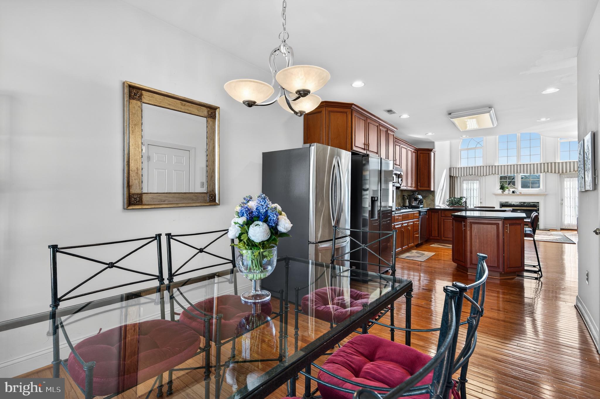 98 Granville Way Exton, PA 19341 - Photo 15 of 35 a view of a dining room with furniture a chandelier and wooden floor
