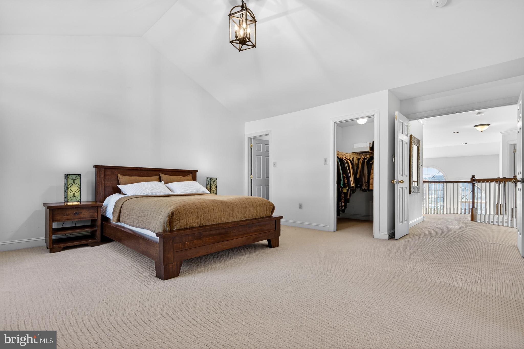 98 Granville Way Exton, PA 19341 - Photo 22 of 35 a bedroom with a bed and a chandelier