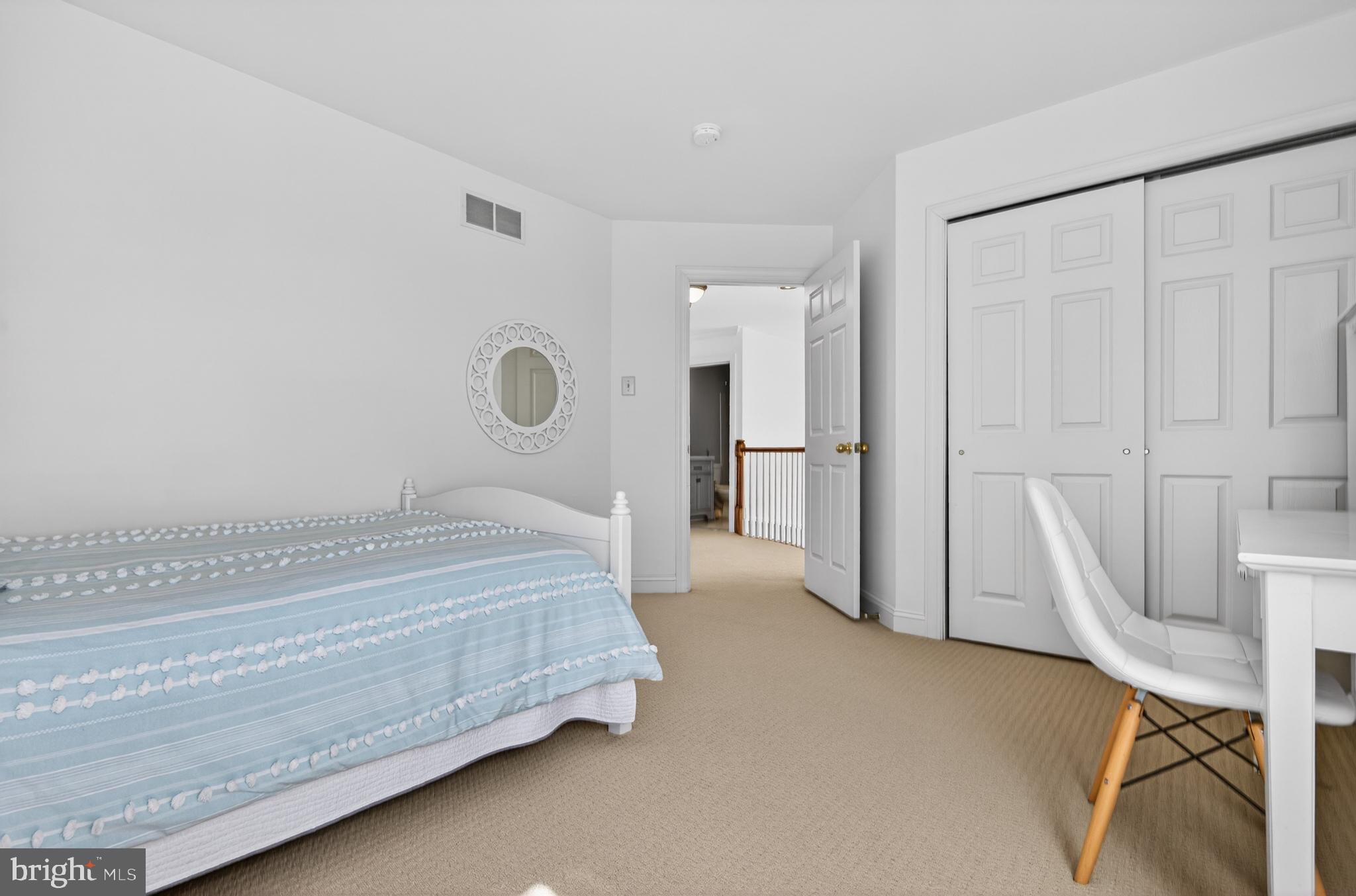 98 Granville Way Exton, PA 19341 - Photo 28 of 35 a spacious bedroom with a bed and a table in it