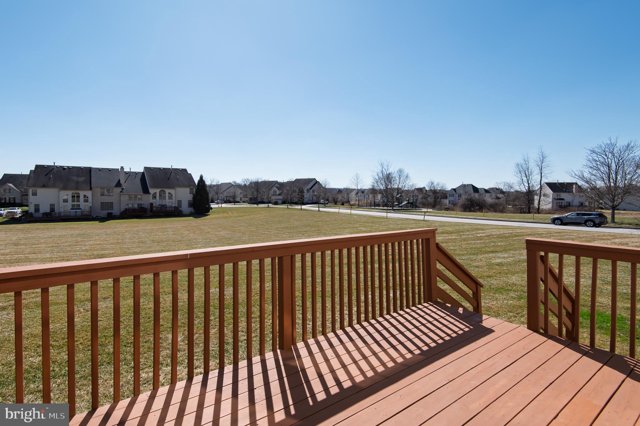 98 Granville Way Exton, PA 19341 - Photo 4 of 35 a balcony with wooden floor and lake view