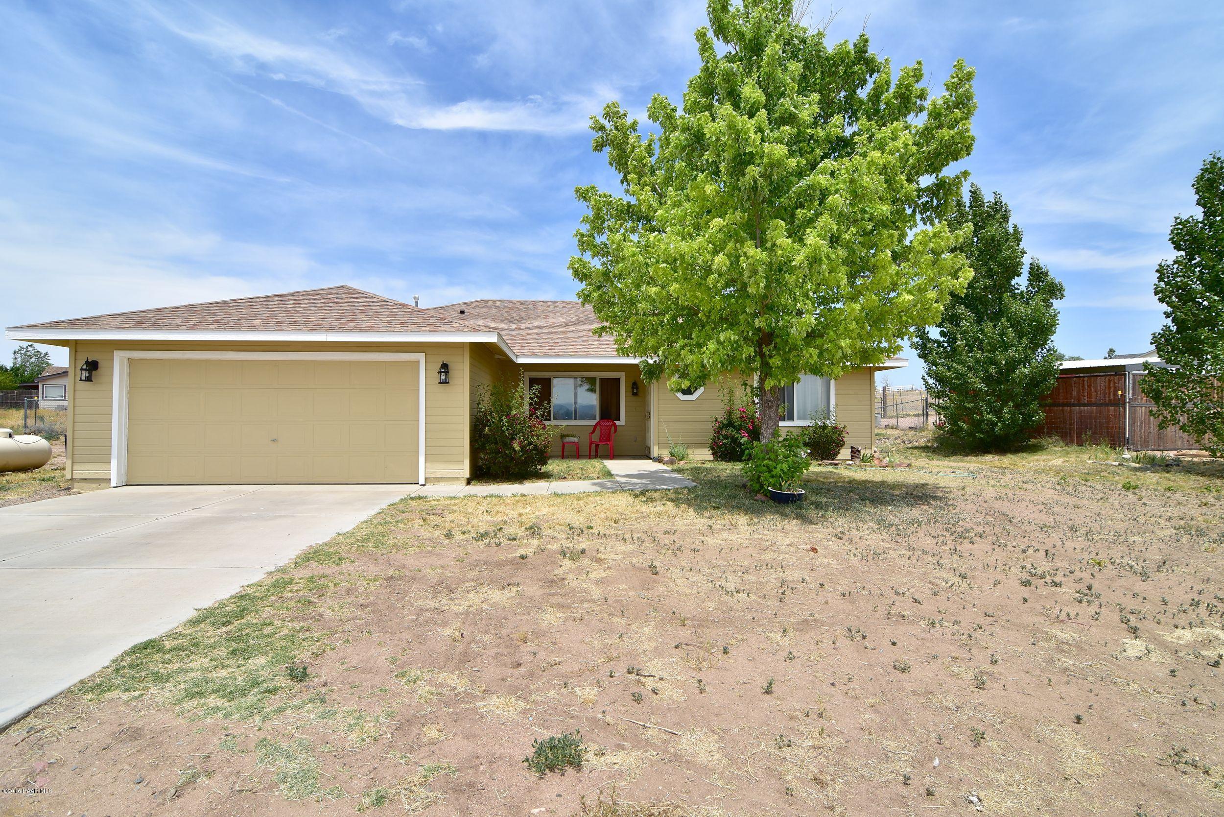 front view of a house with a trees