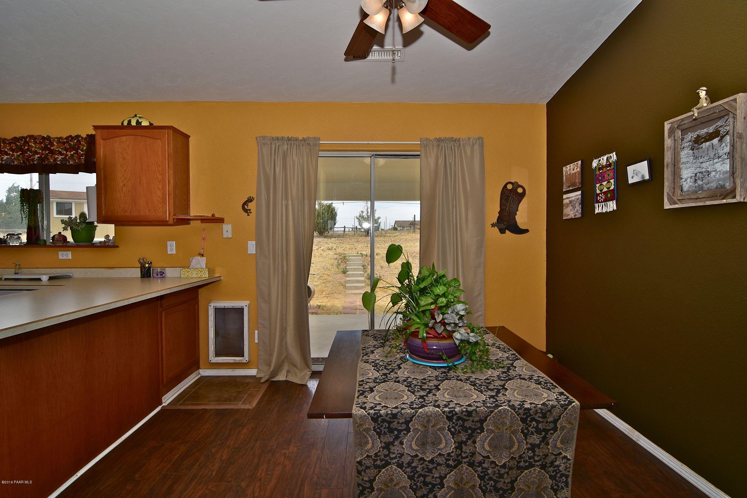 2200 West Lazy Ranch Road Chino Valley, AZ 86323 - Photo 14 of 32 a room with painting on the wall and a potted plant