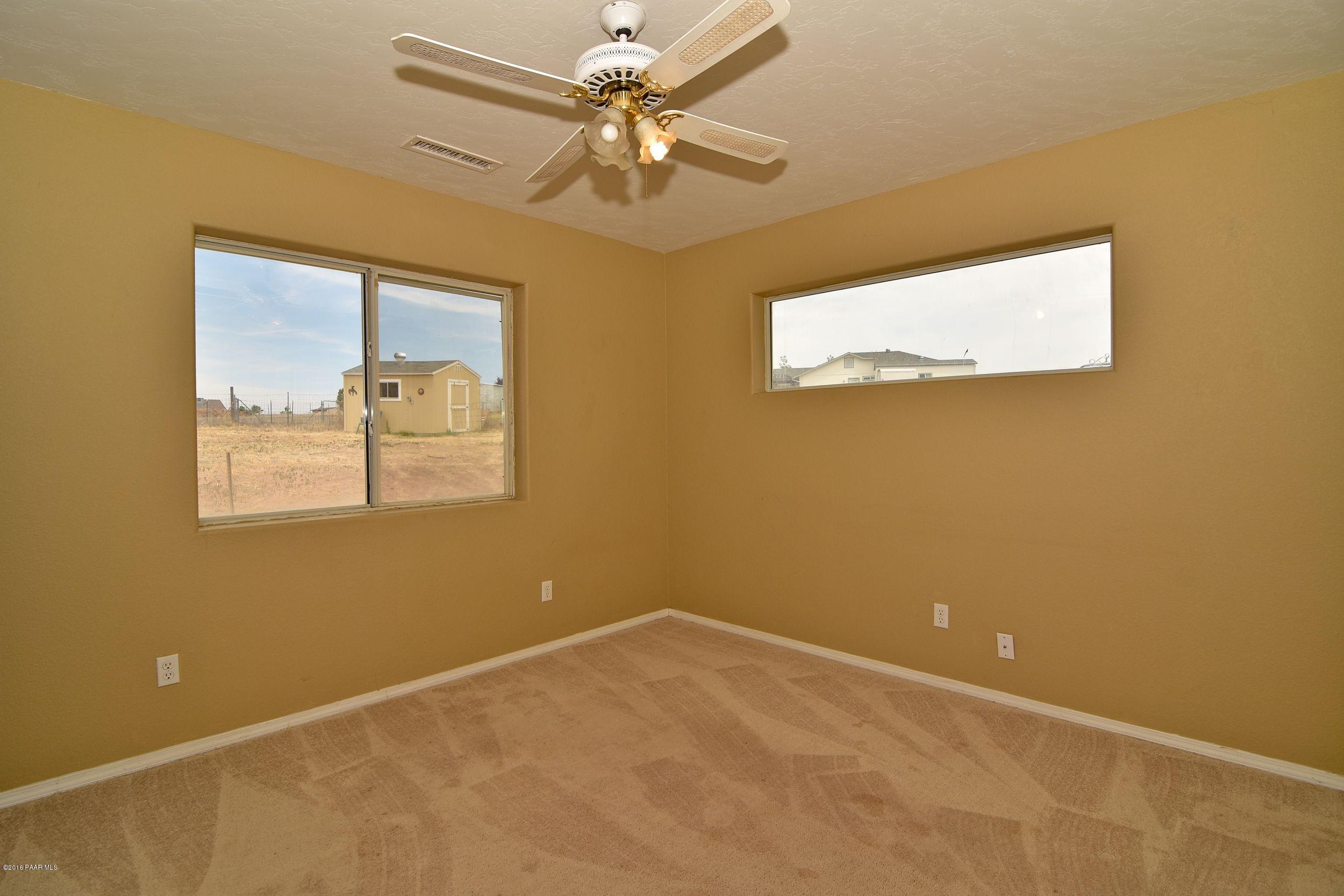 2200 West Lazy Ranch Road Chino Valley, AZ 86323 - Photo 20 of 32 an empty room with a window
