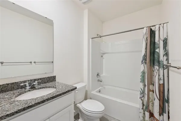 a bathroom with a sink a mirror and vanity