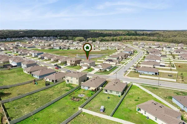 an aerial view of residential building and lake