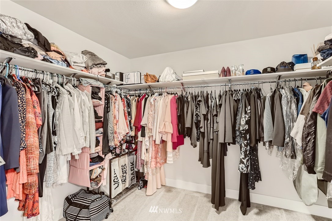 11427 Southeast 162nd Street Renton, WA 98055 - Photo 14 of 25 a view of walk in closet with clothes