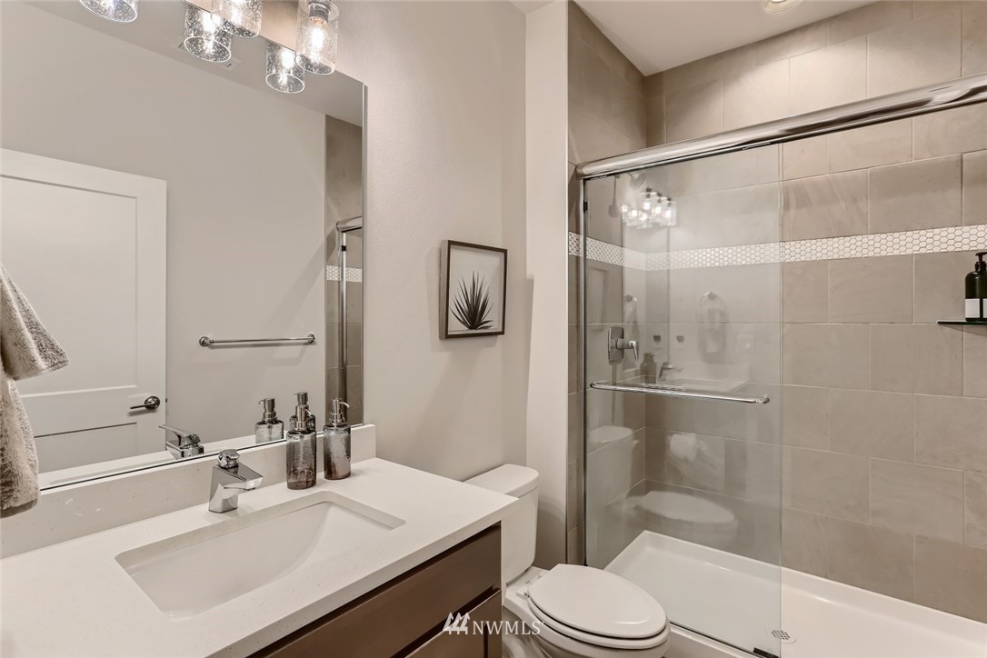11427 Southeast 162nd Street Renton, WA 98055 - Photo 8 of 25 a bathroom with a sink toilet and shower