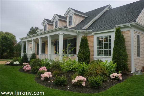 200 Katama Road Edgartown, MA 02539 - Photo 1 of 26 a front view of a house with a big yard and potted plants