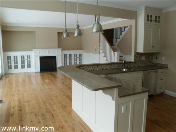 200 Katama Road Edgartown, MA 02539 - Photo 22 of 26 a kitchen that has a lot of cabinets in it and wooden floor