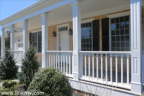 200 Katama Road Edgartown, MA 02539 - Photo 6 of 26 a view of a black chair in front of house