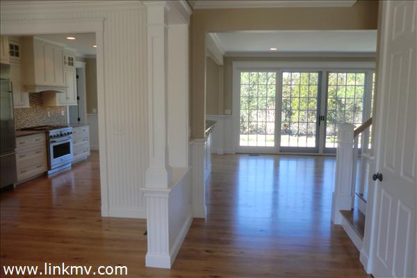 200 Katama Road Edgartown, MA 02539 - Photo 9 of 26 a view of a hallway with wooden floor and a living room