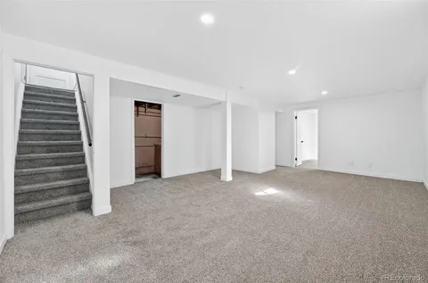 a view of an empty room with a fireplace