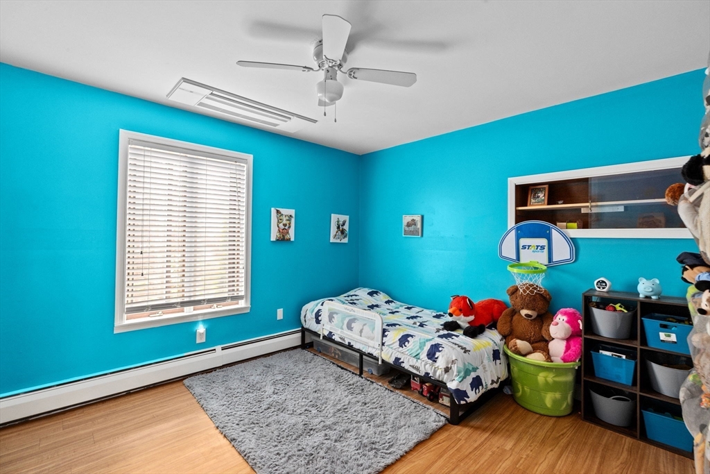 39 High Street Freetown, MA 02702 - Photo 16 of 42 a bedroom with a bed and a dresser