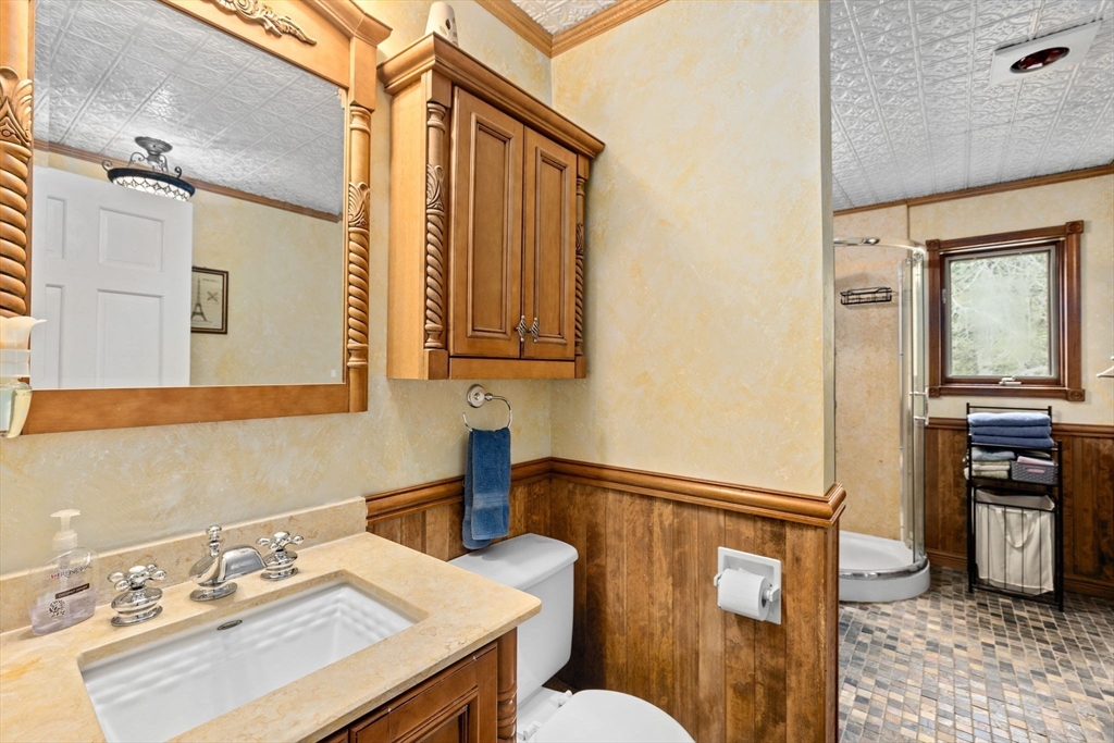 39 High Street Freetown, MA 02702 - Photo 20 of 42 a bathroom with a sink and a mirror