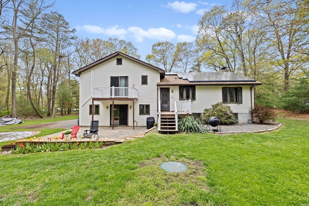 39 High Street Freetown, MA 02702 - Photo 3 of 42 a view of a house with a yard patio and fire pit