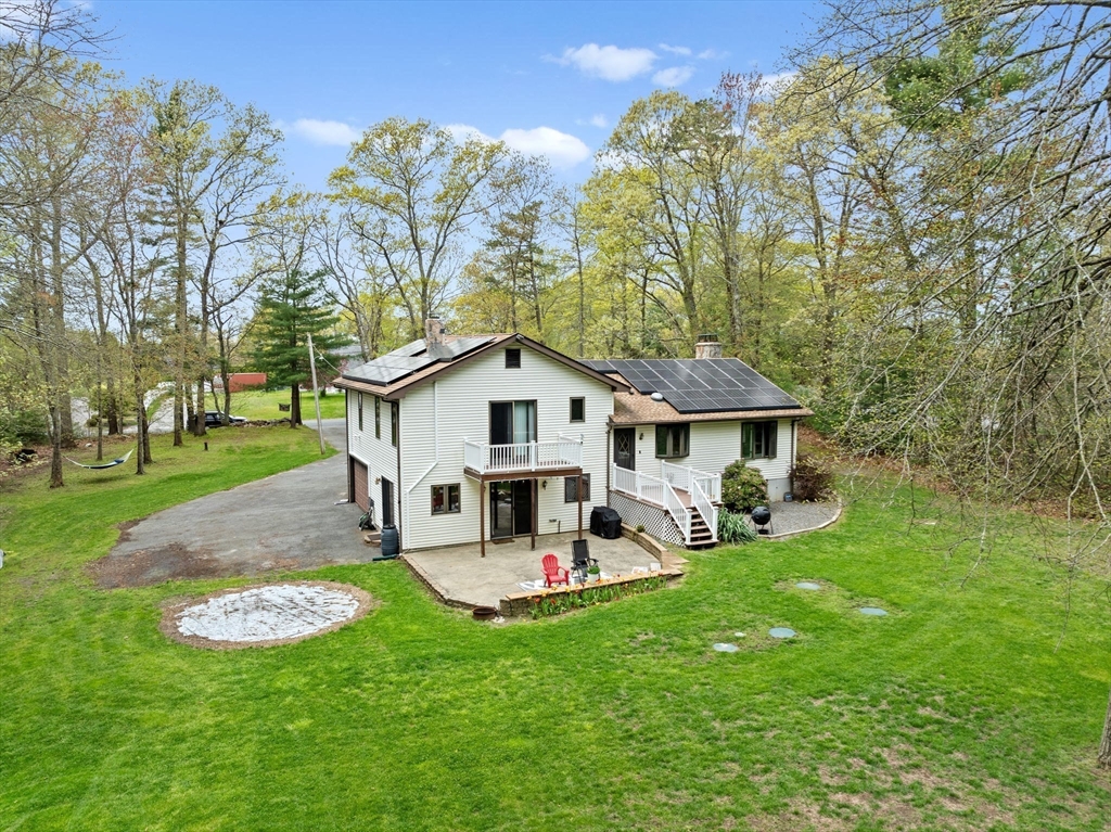 39 High Street Freetown, MA 02702 - Photo 38 of 42 a view of a house with a yard and sitting area