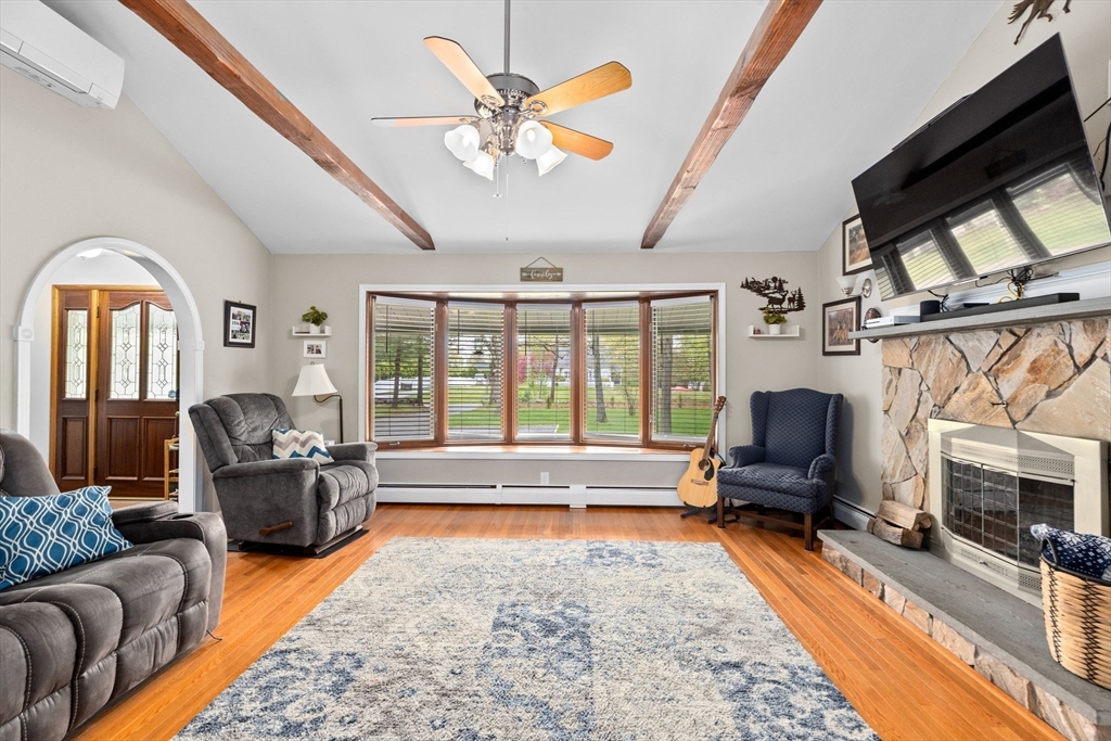 39 High Street Freetown, MA 02702 - Photo 6 of 42 a living room with furniture fireplace and a flat screen tv