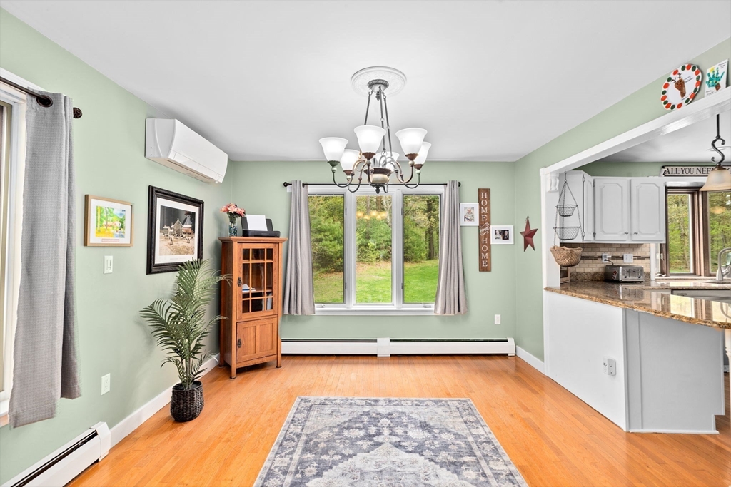 39 High Street Freetown, MA 02702 - Photo 9 of 42 a very nice looking room with a large window and chandelier