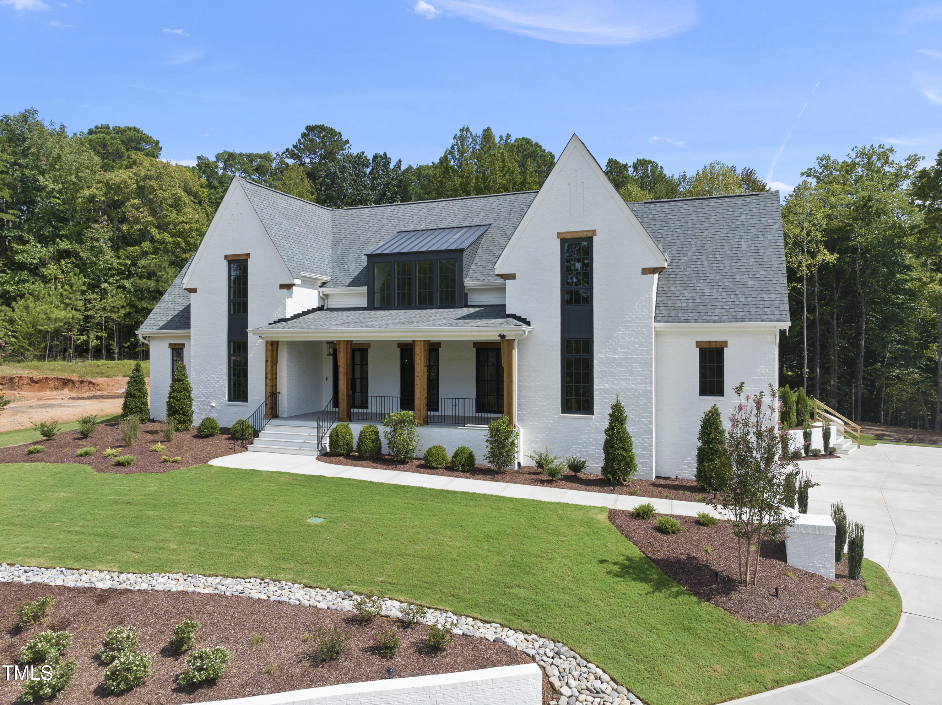 5824 Norwood Rdg Drive Raleigh, NC 27614 - Photo 4 of 65 a front view of house with a garden and patio