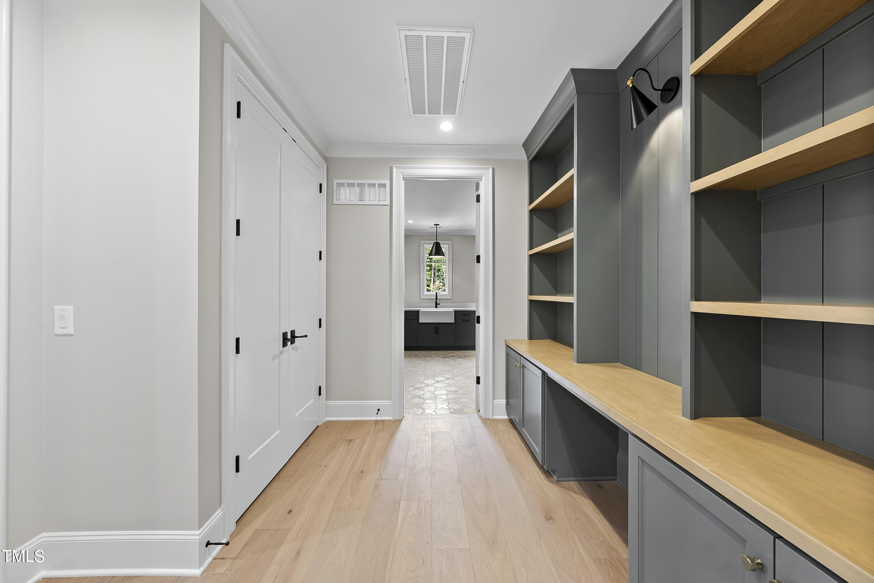 5824 Norwood Rdg Drive Raleigh, NC 27614 - Photo 54 of 65 a view of hallway with wooden floor and cabinets