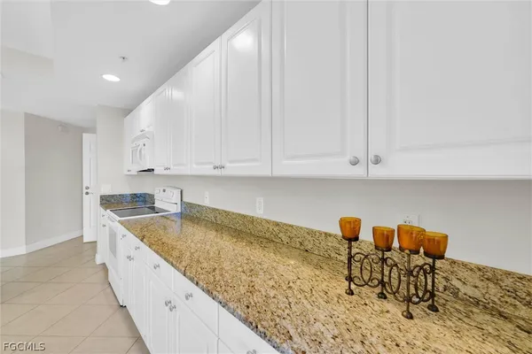 a bathroom with a granite countertop double sink and mirror