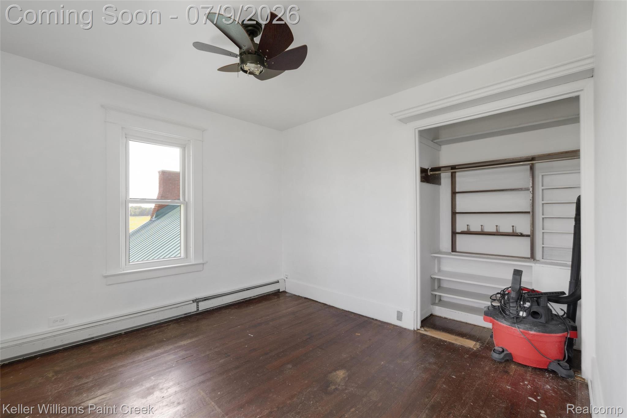 28780 School Section Road Richmond, MI 48062 - Photo 12 of 50 Room featuring a ceiling fan, a window with white trim, and baseboard heating