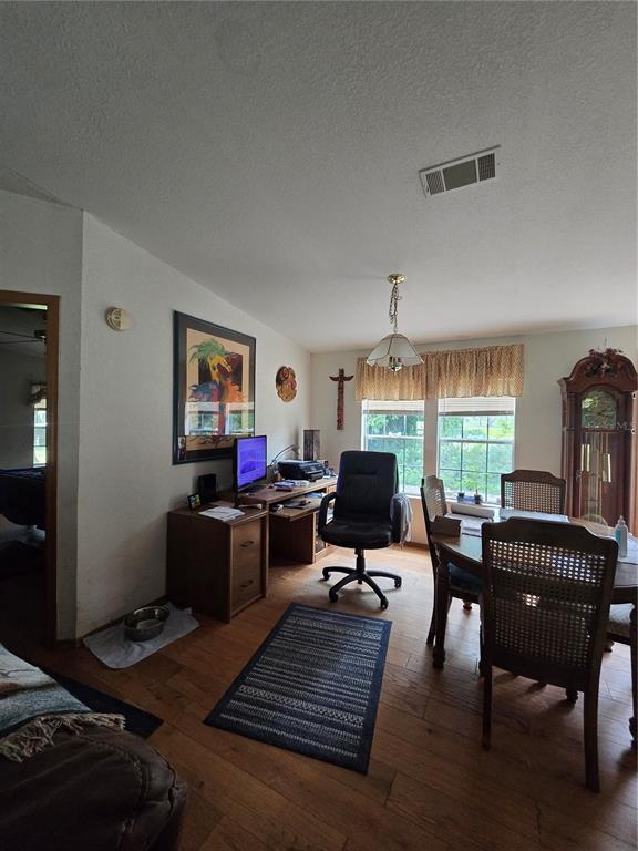 4901 Northwest 152nd Lane Reddick, FL 32686 - Photo 9 of 13 a living room with furniture a window and a fireplace