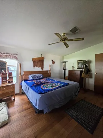 a bedroom with bed and window