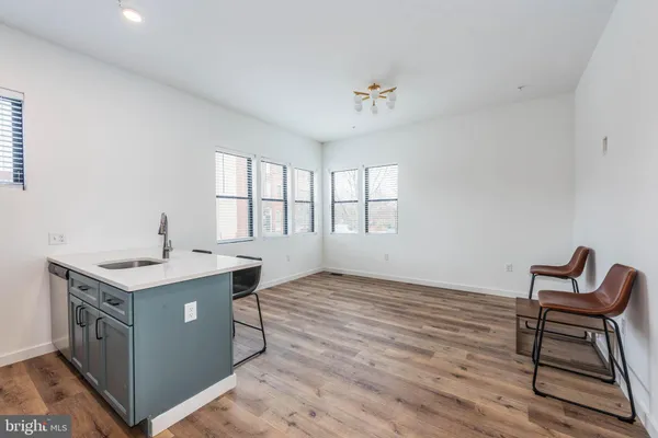 a workspace with wooden floor and a window