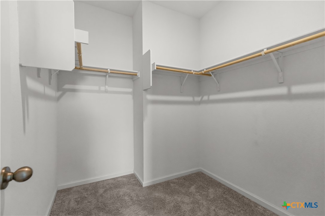 430 Line Of Fire Way Jarrell, TX 76537 - Photo 15 of 28 a view of an empty walk in closet