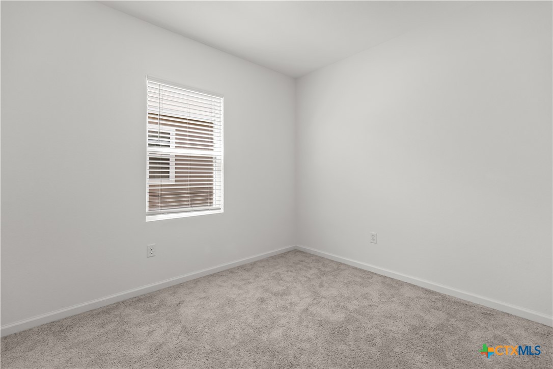 430 Line Of Fire Way Jarrell, TX 76537 - Photo 20 of 28 an empty room with a window