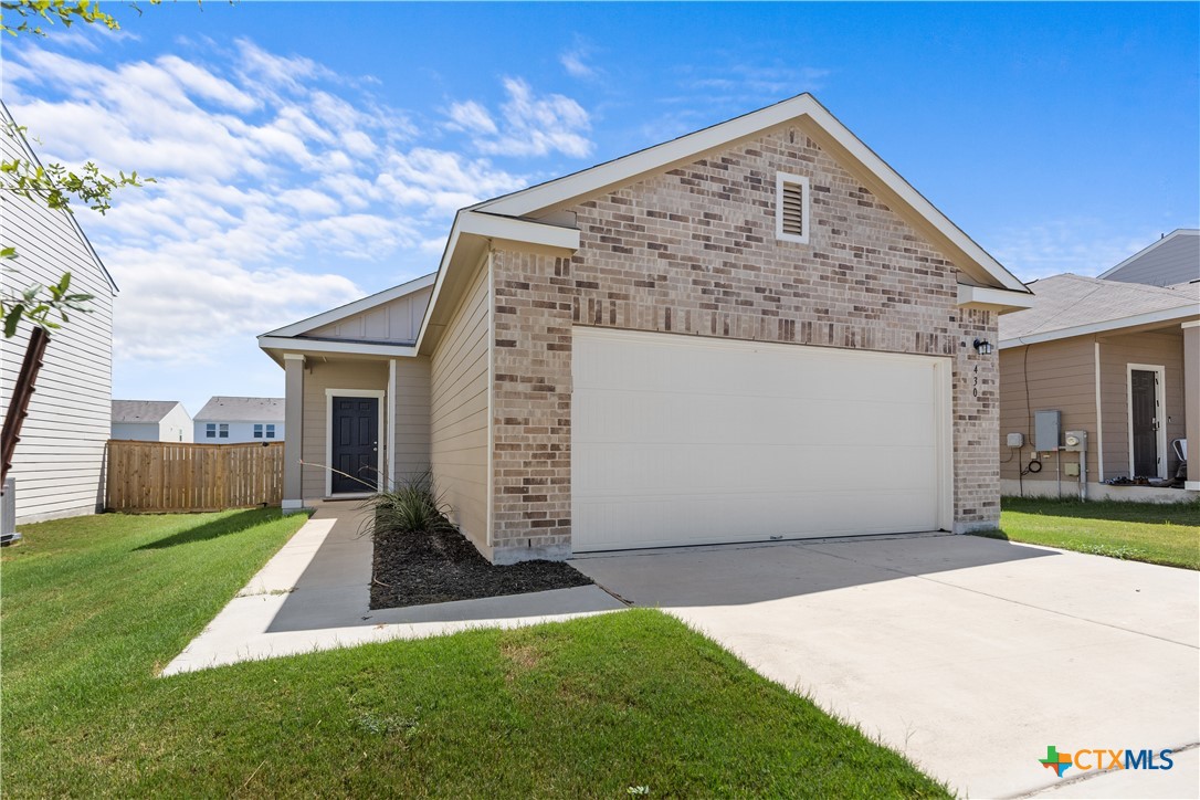 430 Line Of Fire Way Jarrell, TX 76537 - Photo 2 of 28 a view of an house with backyard porch and garden