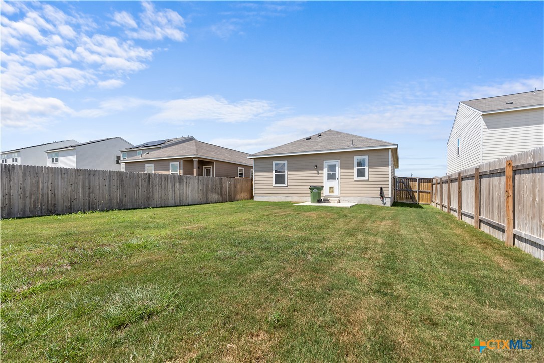430 Line Of Fire Way Jarrell, TX 76537 - Photo 25 of 28 a front view of a house with garden