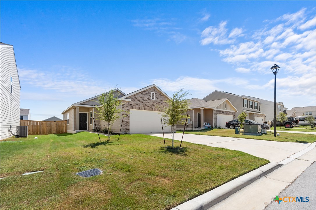 430 Line Of Fire Way Jarrell, TX 76537 - Photo 5 of 28 a front view of a house with a yard