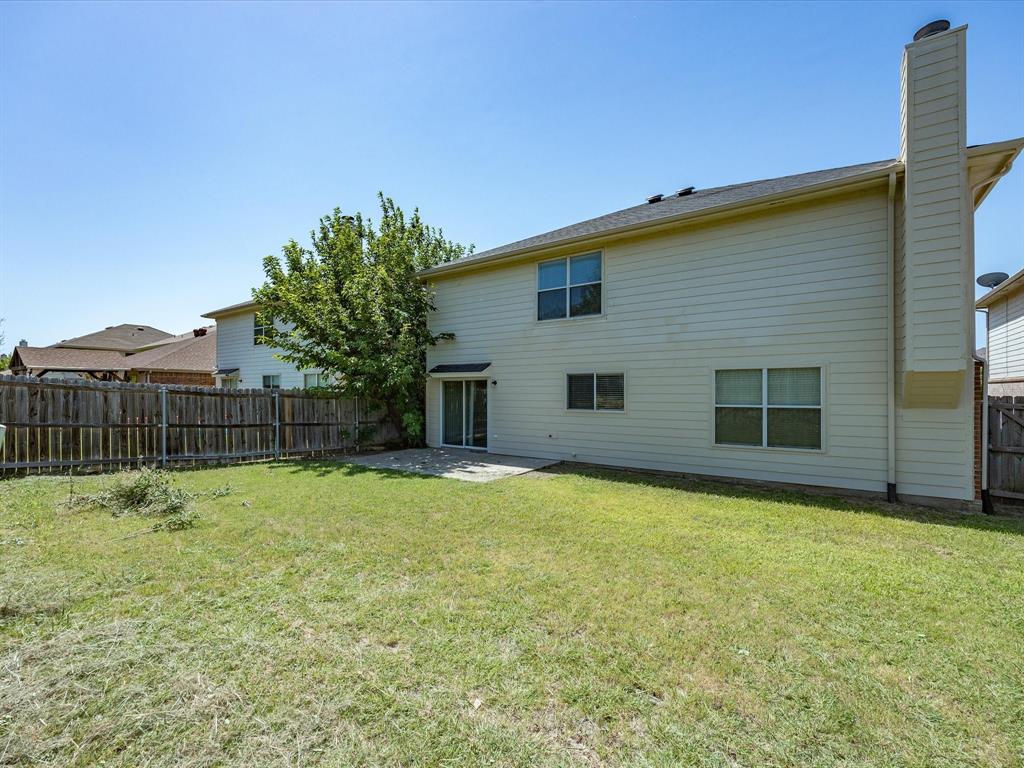 2021 Laughlin Road Fort Worth, TX 76177 - Photo 40 of 40 a backyard of a house with table and chairs