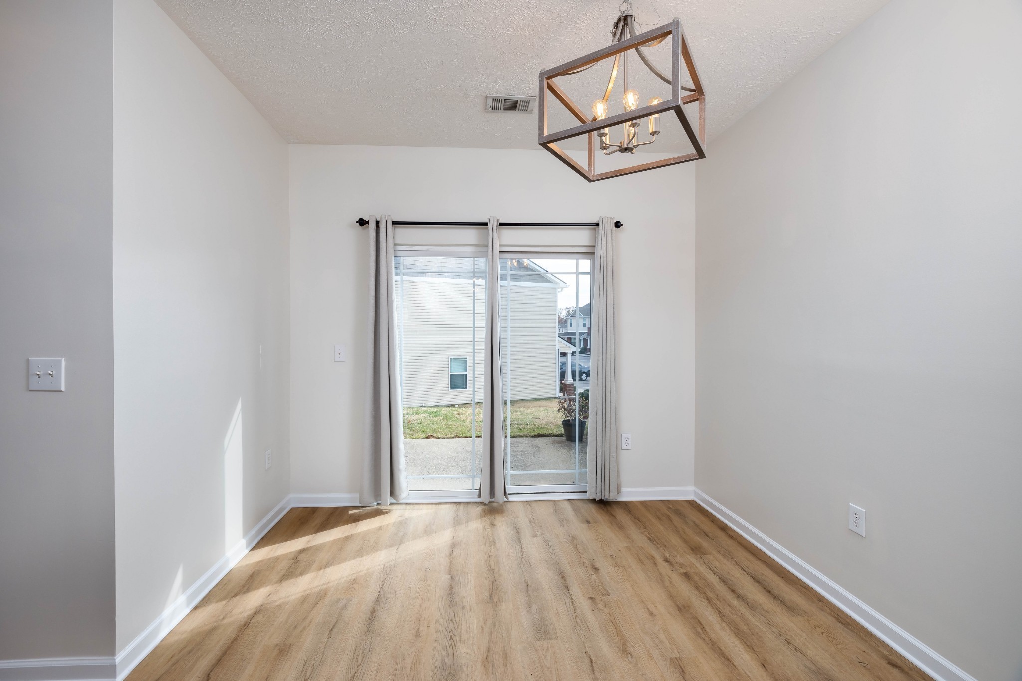 1011 Somerset Springs Drive Spring Hill, TN 37174 - Photo 12 of 28 a view of a room with wooden floor closet and windows