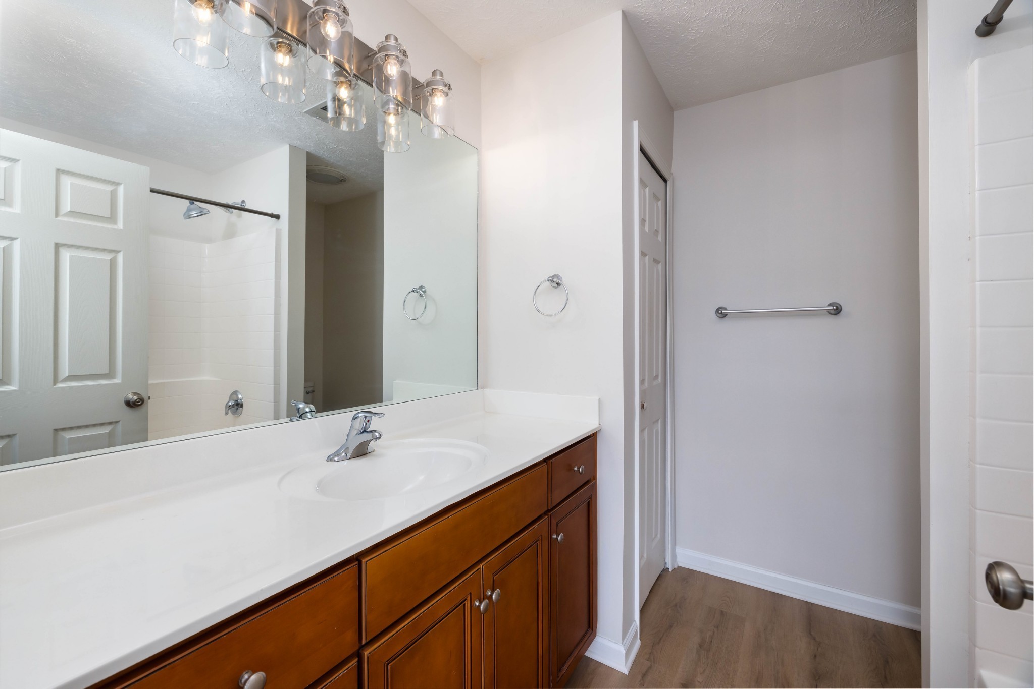 1011 Somerset Springs Drive Spring Hill, TN 37174 - Photo 17 of 28 a bathroom with a sink vanity granite and a mirror