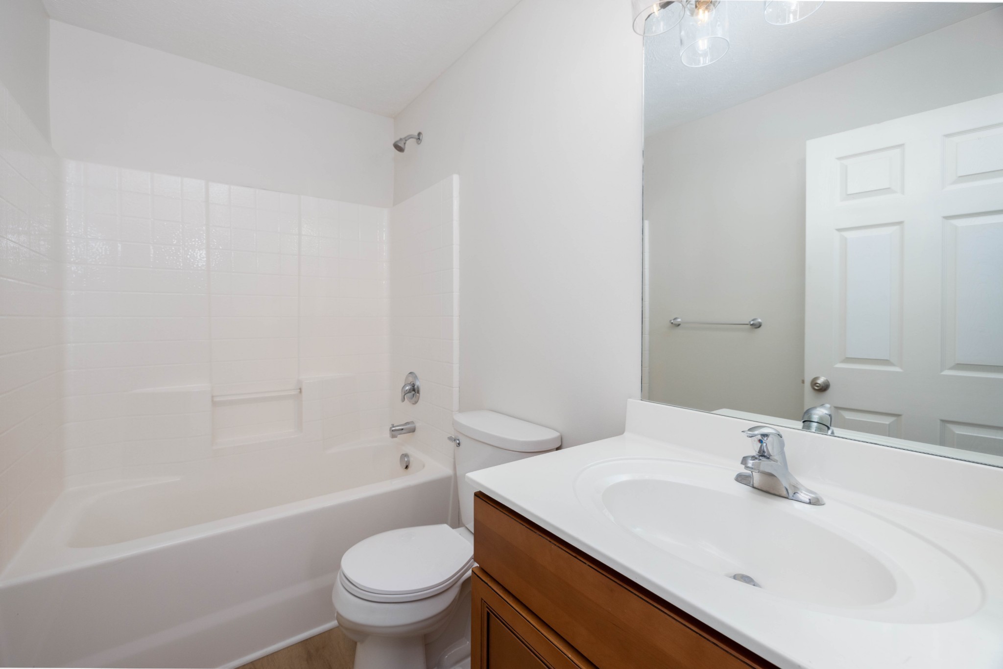 1011 Somerset Springs Drive Spring Hill, TN 37174 - Photo 23 of 28 a bathroom with a sink a toilet and a bathtub