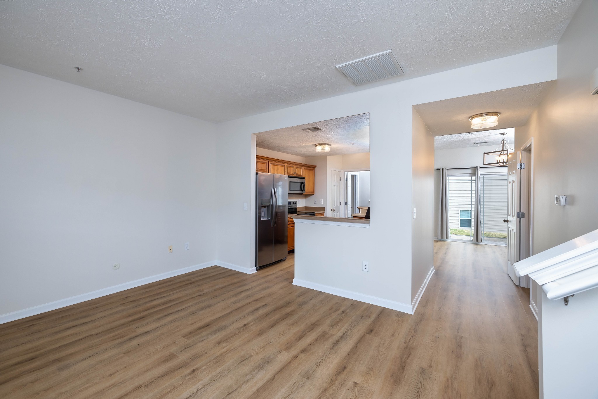1011 Somerset Springs Drive Spring Hill, TN 37174 - Photo 5 of 28 a view of a kitchen cabinets and wooden floor