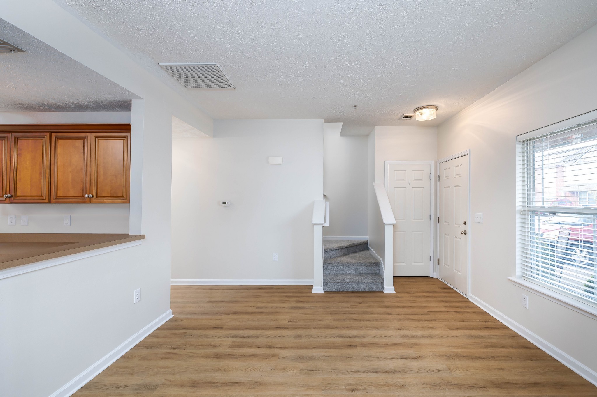 1011 Somerset Springs Drive Spring Hill, TN 37174 - Photo 6 of 28 a view of empty room with wooden floor and fan