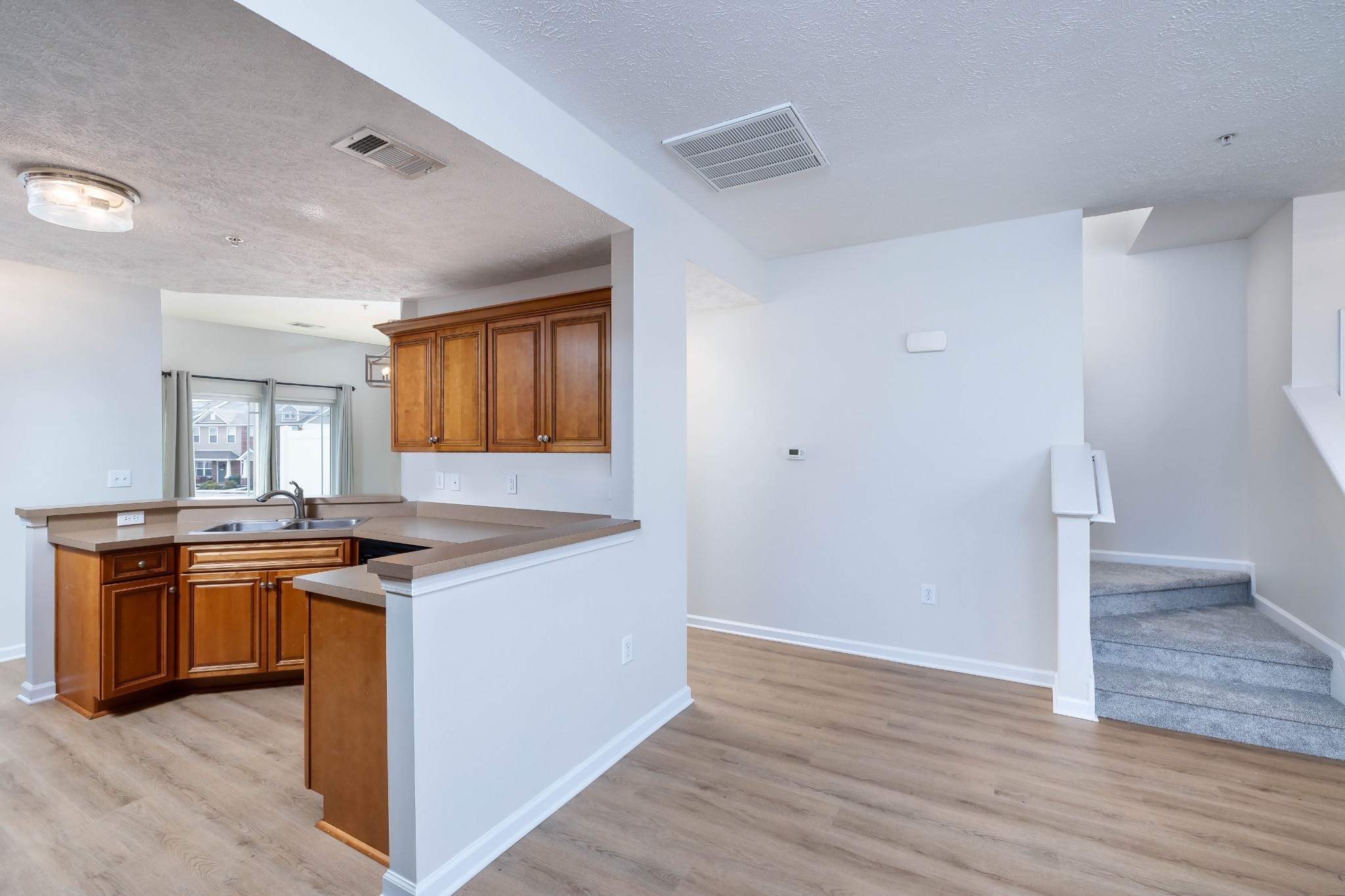 1011 Somerset Springs Drive Spring Hill, TN 37174 - Photo 7 of 28 a kitchen with stainless steel appliances granite countertop a stove and a refrigerator