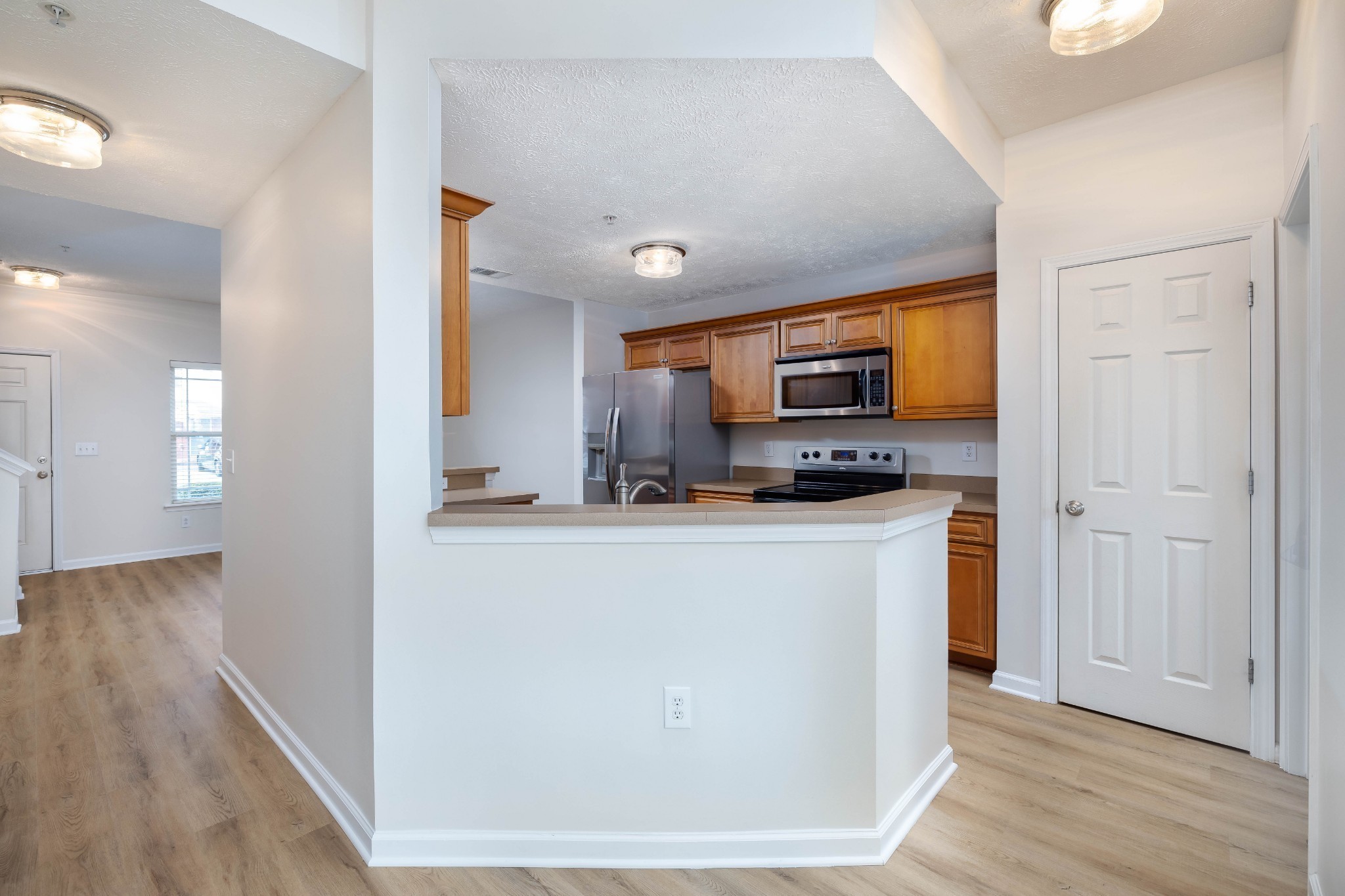 1011 Somerset Springs Drive Spring Hill, TN 37174 - Photo 8 of 28 a kitchen with stainless steel appliances granite countertop a refrigerator a stove top oven a sink and dishwasher
