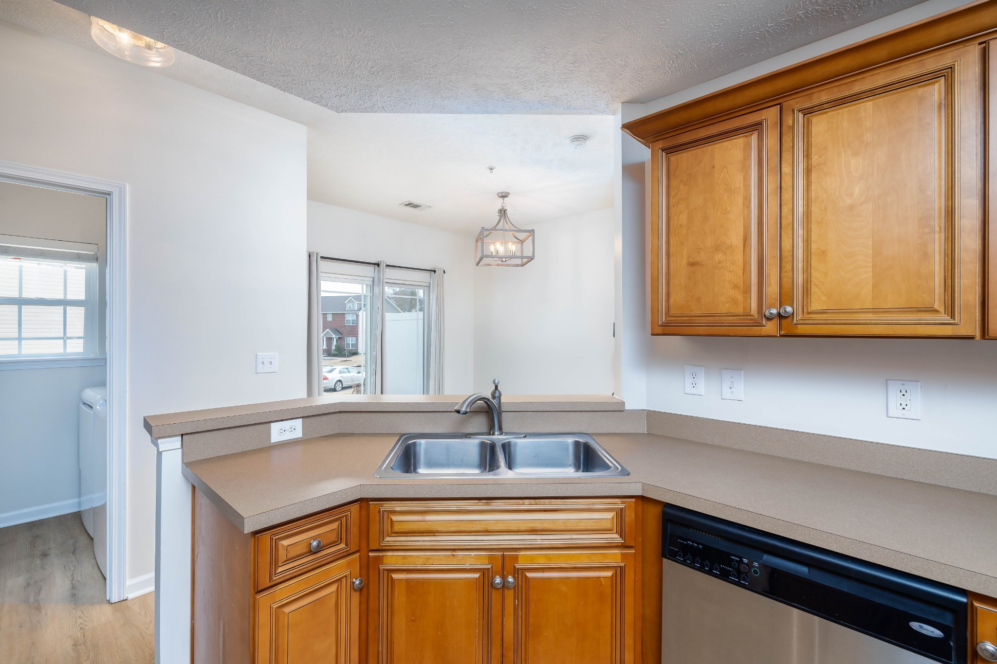 1011 Somerset Springs Drive Spring Hill, TN 37174 - Photo 9 of 28 a kitchen with stainless steel appliances granite countertop a sink and cabinets