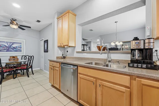 a view of a dining room that has a table and chairs