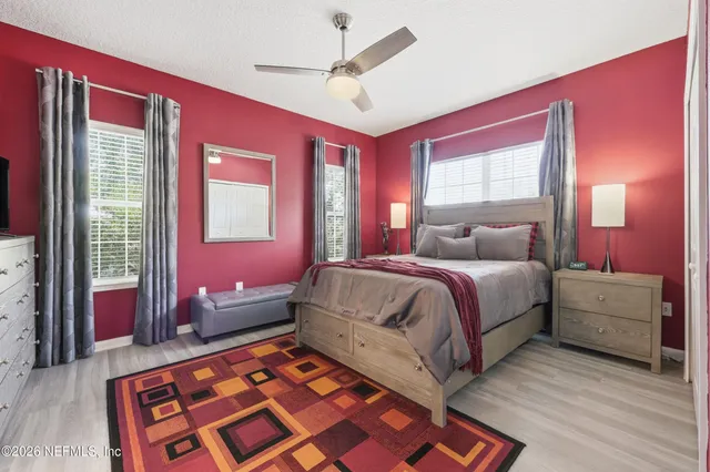 a bedroom with a bed and window