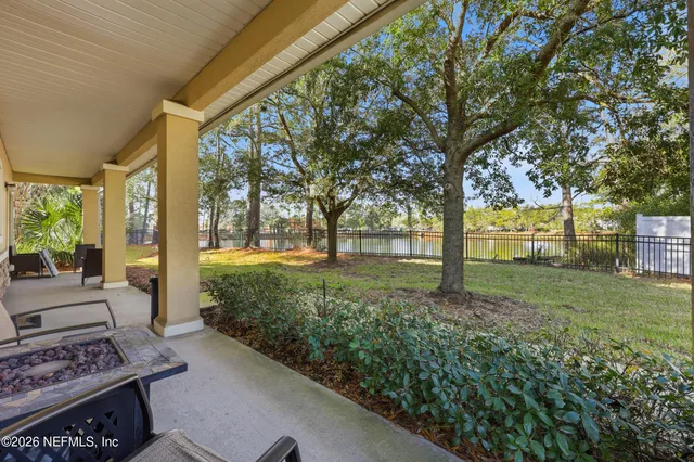 a view of a hallway with paintings on the wall