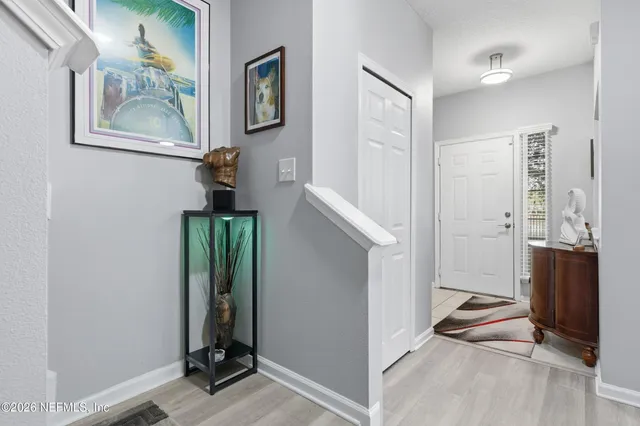 a view of bathroom with a sink and mirror