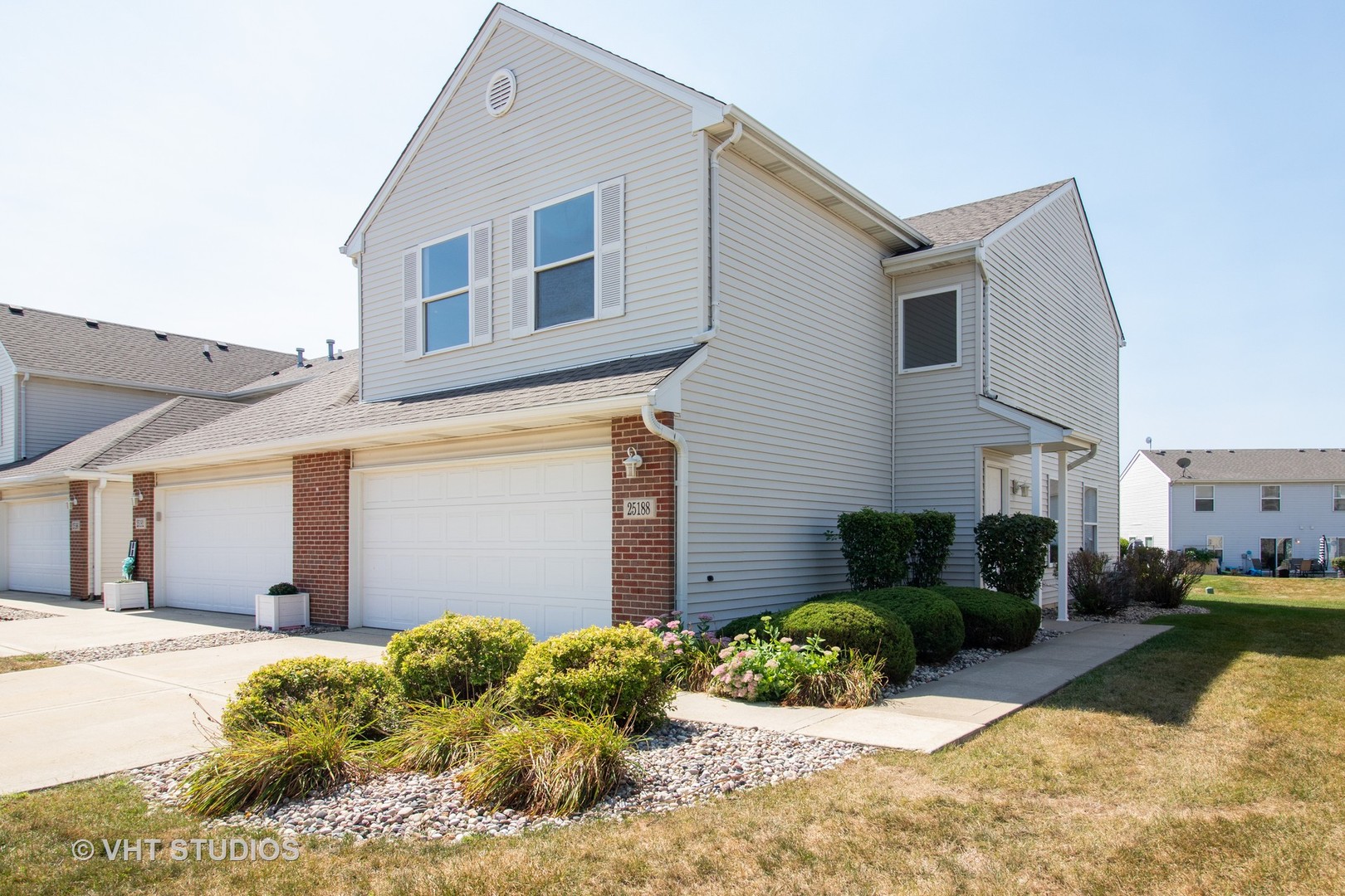 25188 Faraday Road Manhattan, IL 60442 - Photo 1 of 10 a front view of a house with a yard