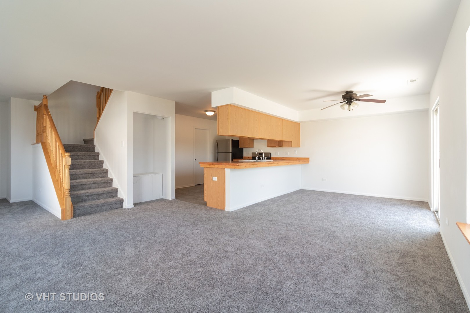 25188 Faraday Road Manhattan, IL 60442 - Photo 3 of 10 a view of a kitchen with furniture and a ceiling fan